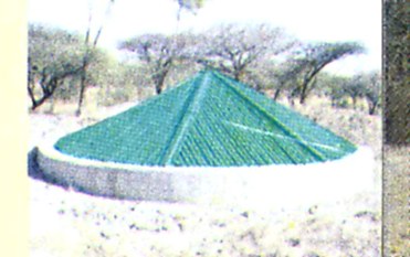A constructed water point serving wildlife in a park buffer zone